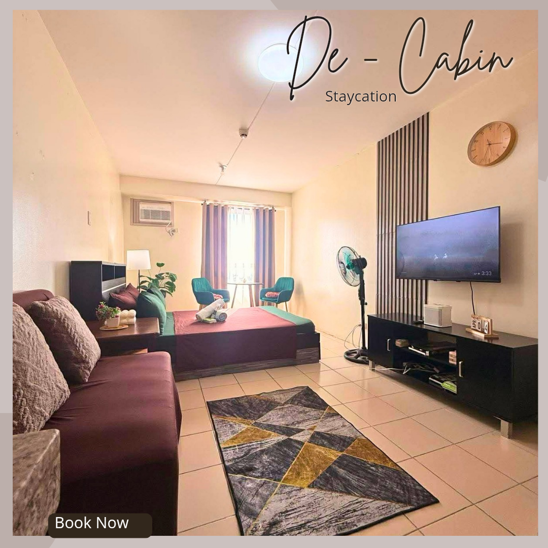 Urban Den — wide room view with TV wall